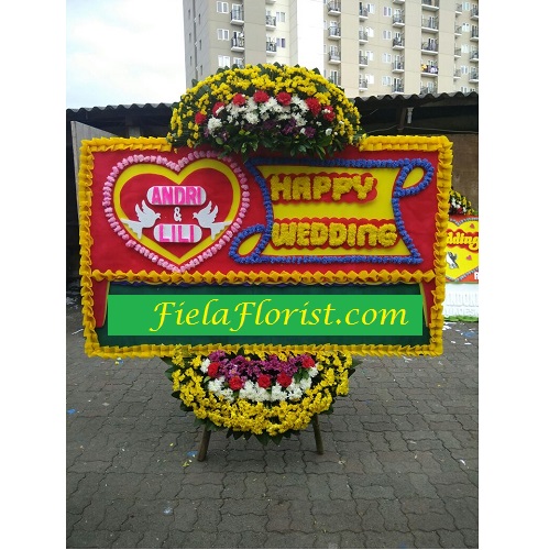 Bunga Papan Jakarta Ucapan Happy Wedding dirangkai untuk mampu mewakili isi hati anda untuk sepasang anak manusia mengikat janji setia.